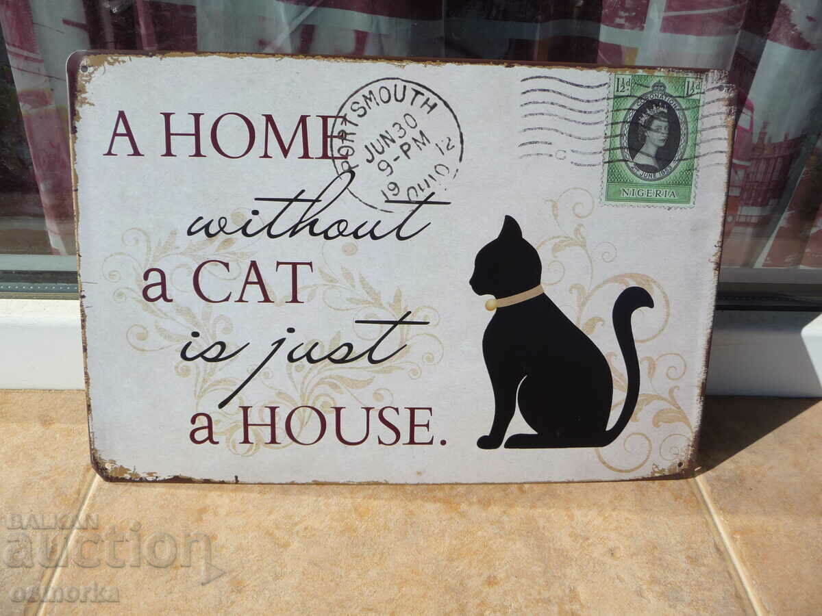 Μεταλλική πινακίδα που λέει το Home without a cat is just a kitten house