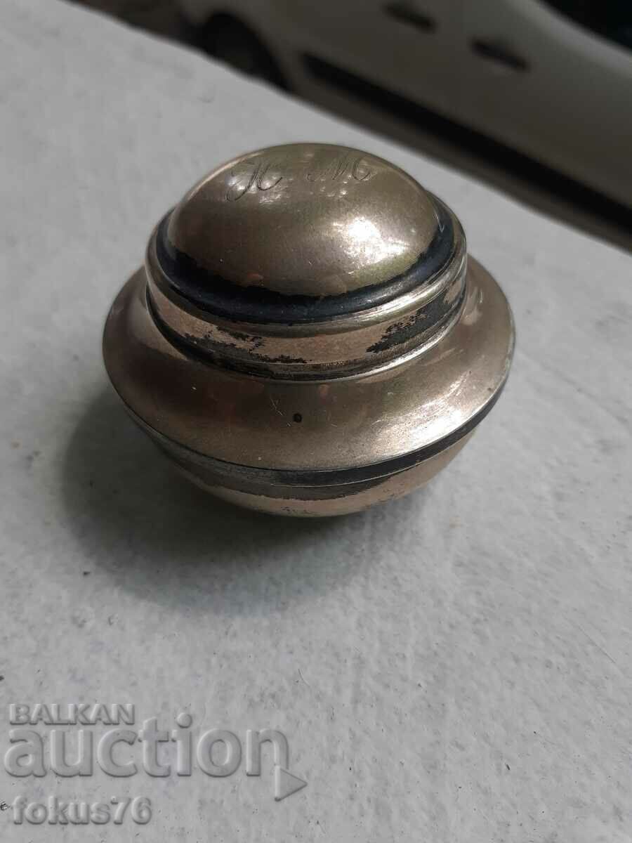 A small silver box I suppose an inkwell