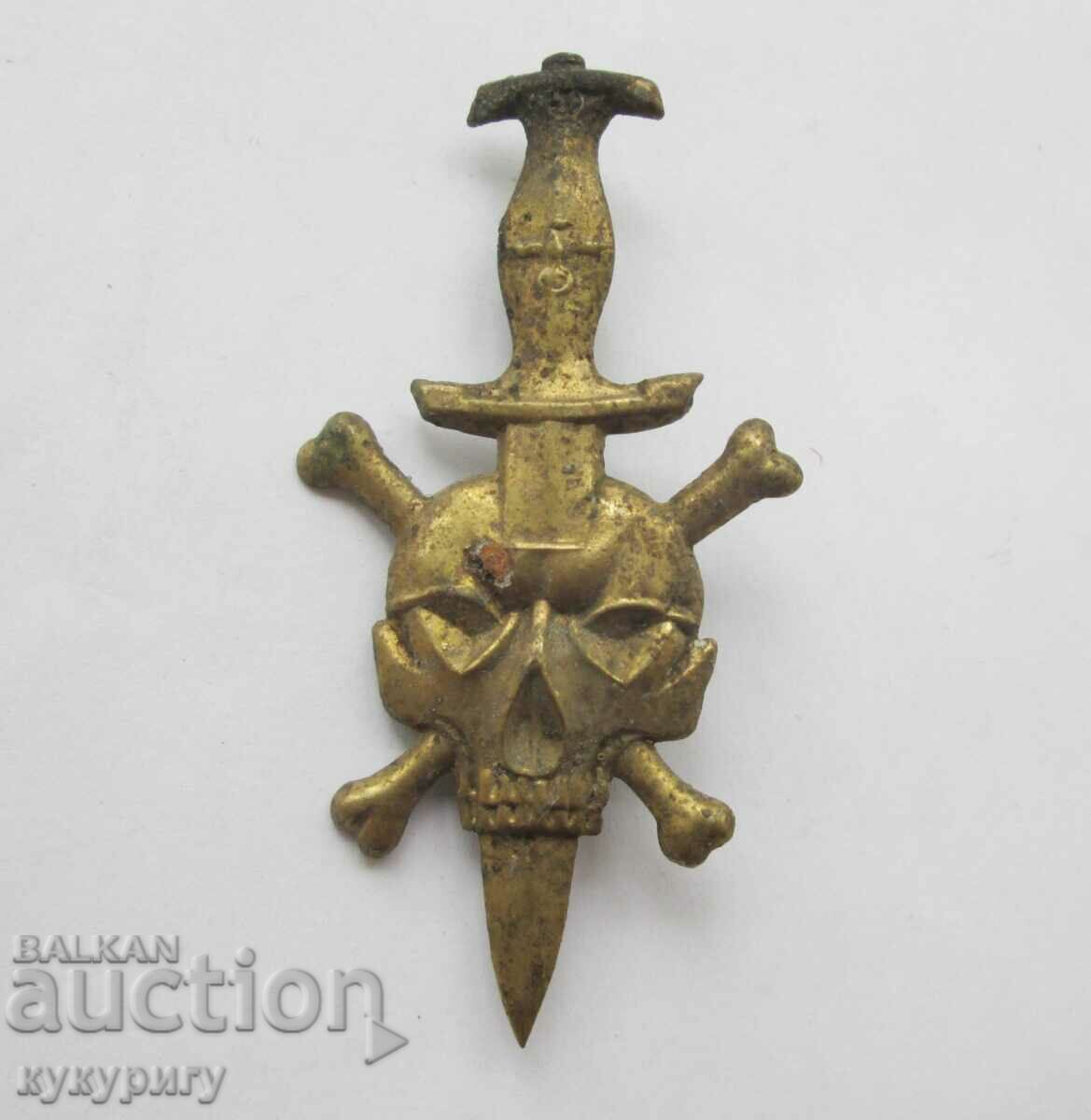 Old bronze sign badge emblem with skull bones cortic