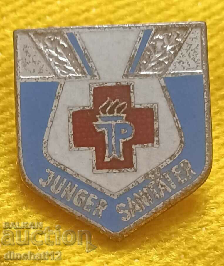 DDR. TP FDJ - Junger Sanitäter. Ερυθρός Σταυρός. Υγειονομικός