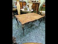 A wonderful antique bronze table with a wooden top