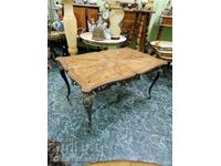 A wonderful antique bronze table with a wooden top