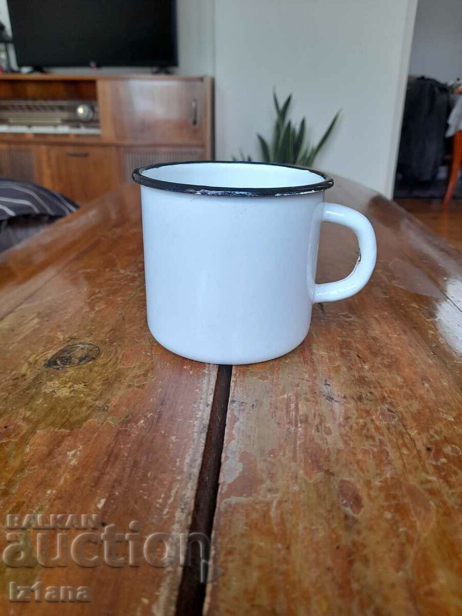 Old enameled jug, cup