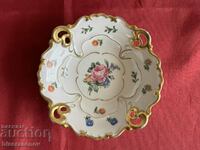 A beautiful porcelain saucer with markings