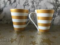 Two mugs with markings