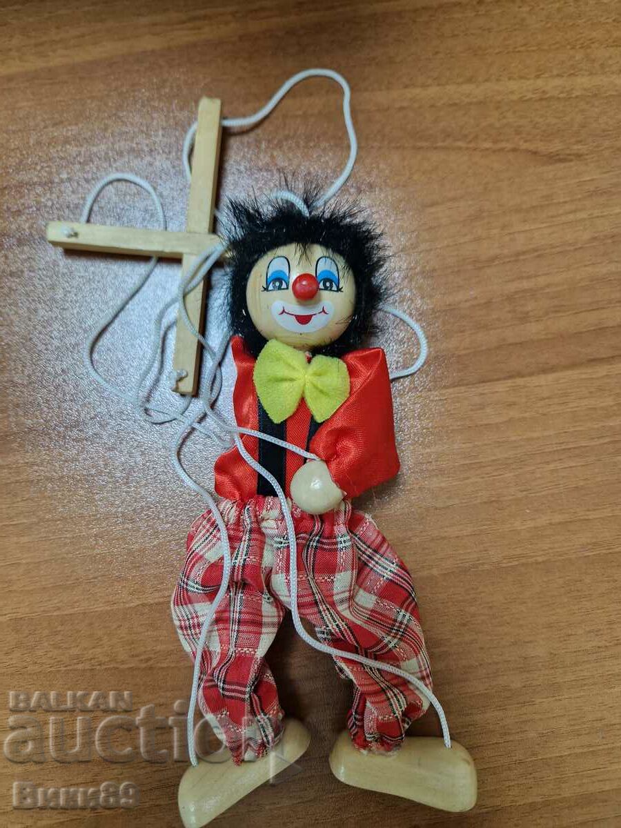 Old children's clown doll on strings
