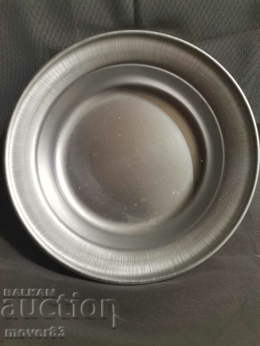 A bowl/plate. Aluminum