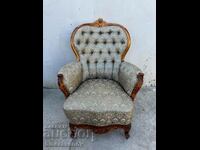 A beautiful baroque armchair with wood carving