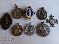 A collection of Catholic medallions.