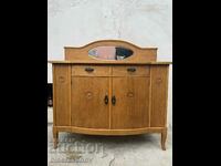 A beautiful cabinet with a mirror