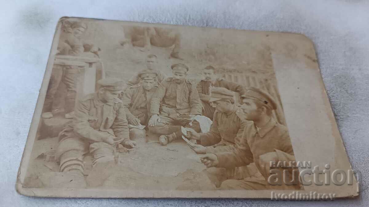 Picture Soldiers playing cards on the front WWI