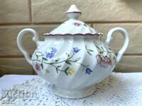 A beautiful porcelain sugar bowl with a lid from England with markings