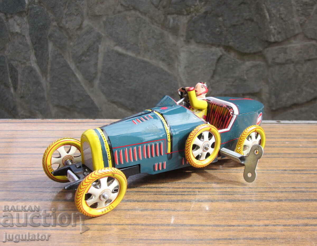 old metal sheet metal mechanical toy car with key