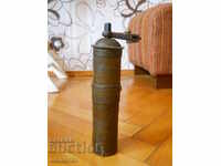 Old bronze coffee grinder with markings