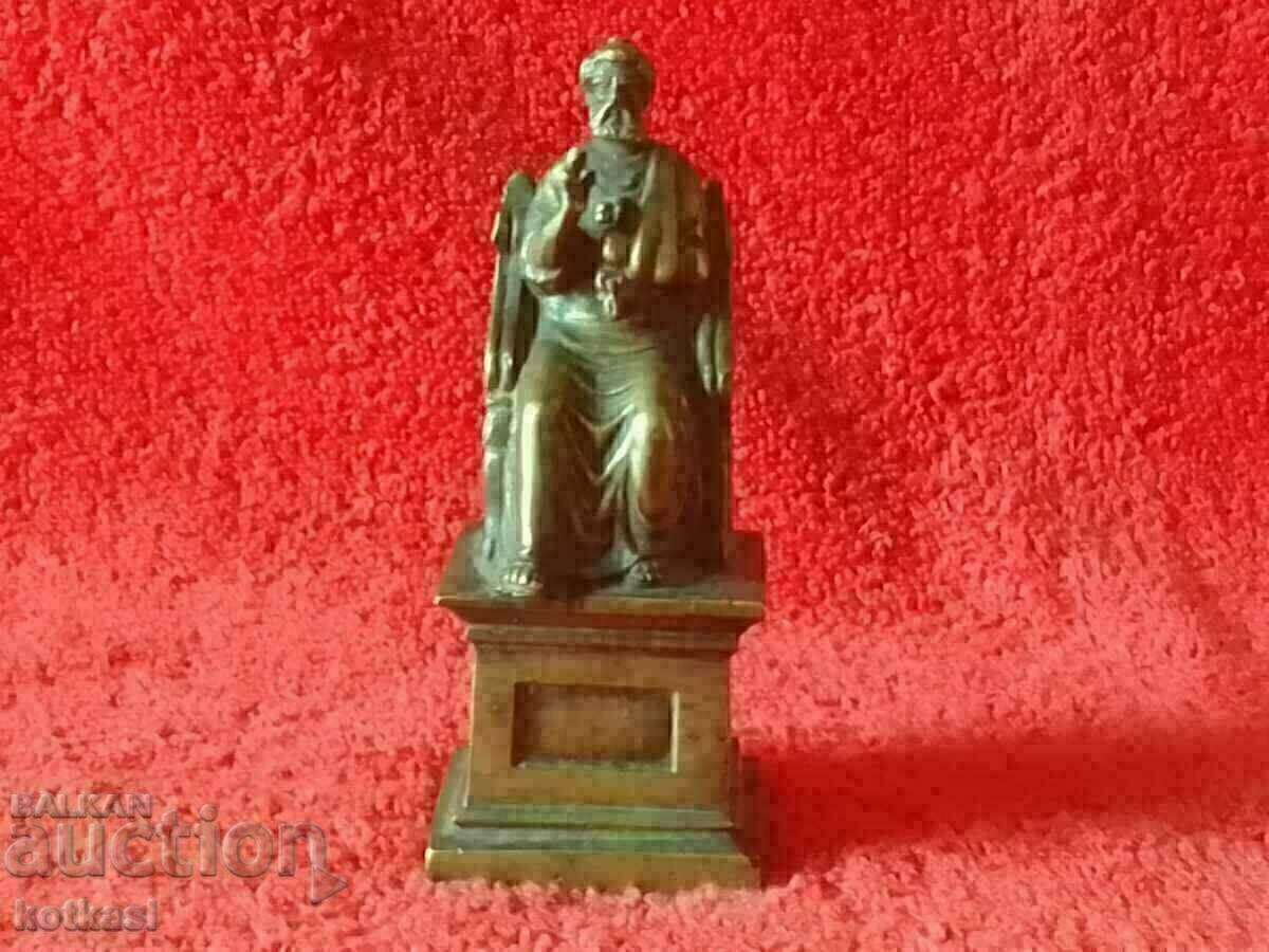Old metal bronze figure statue of St. Peter on the Throne Old metal bronze figure statue of St. Peter on the Throne