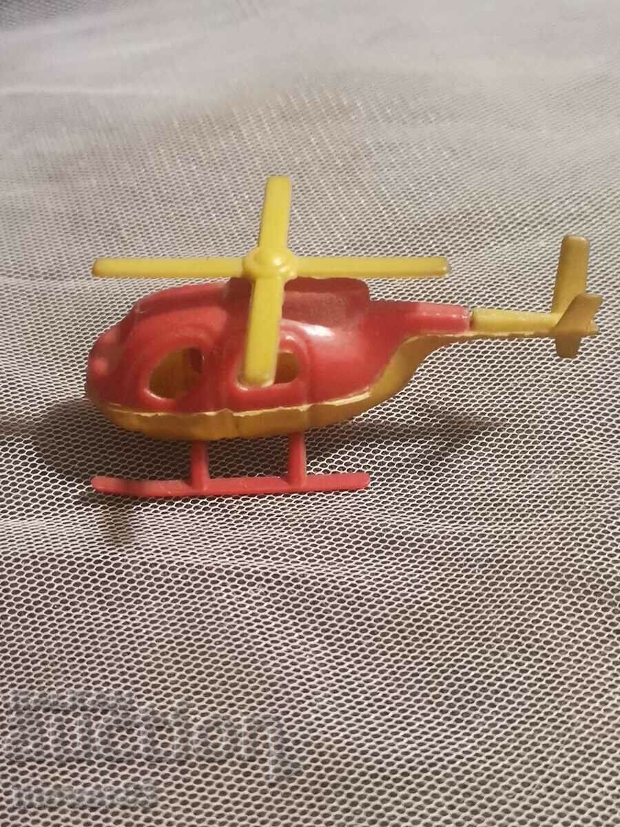 An old little toy. A helicopter