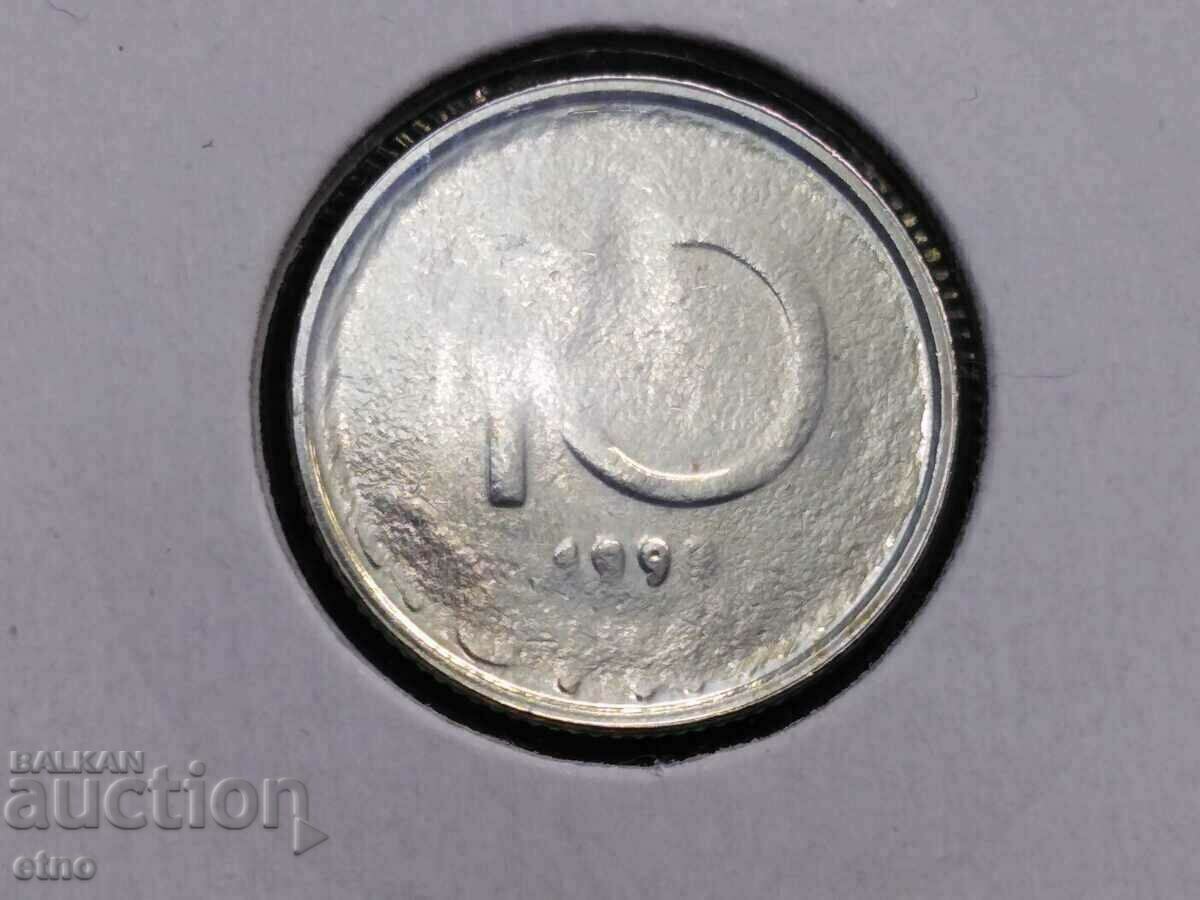 O curiozitate, un defect al unei monede de 10 cenți din 1999.