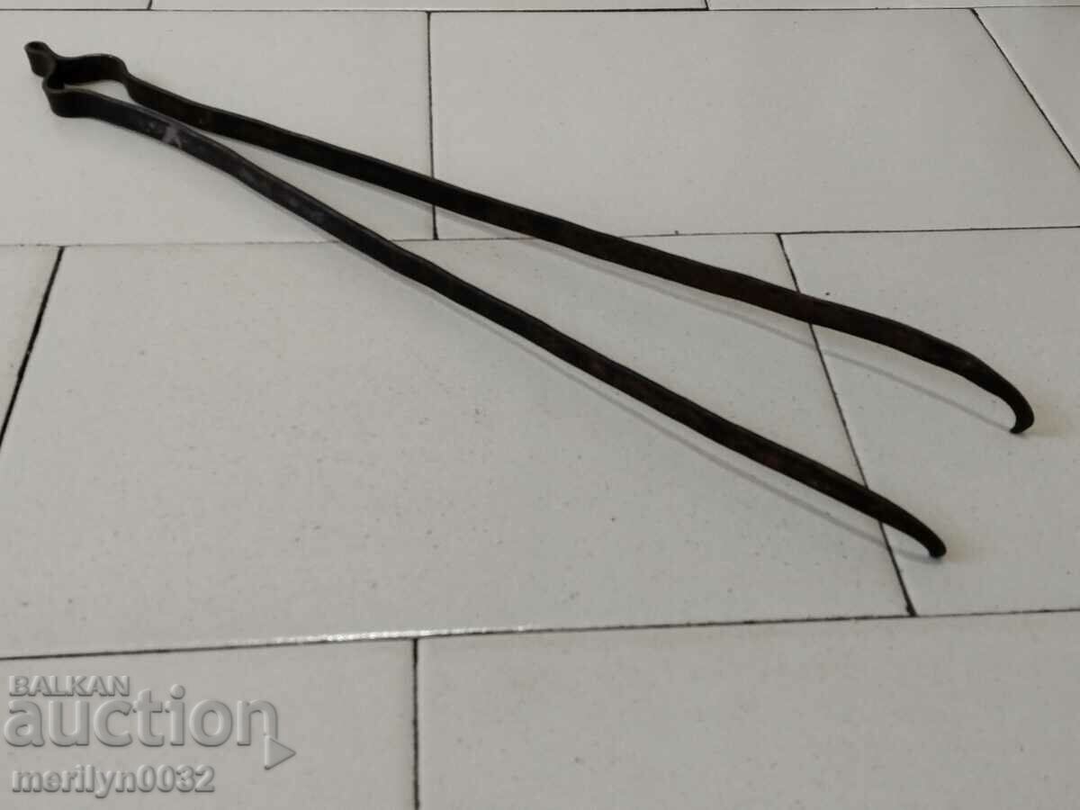 Delivery of Old hand-forged dilaf, wrought iron, tongs Delivery of Old hand-forged dilaf, wrought iron, tongs