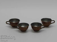 Small copper cups for brandy