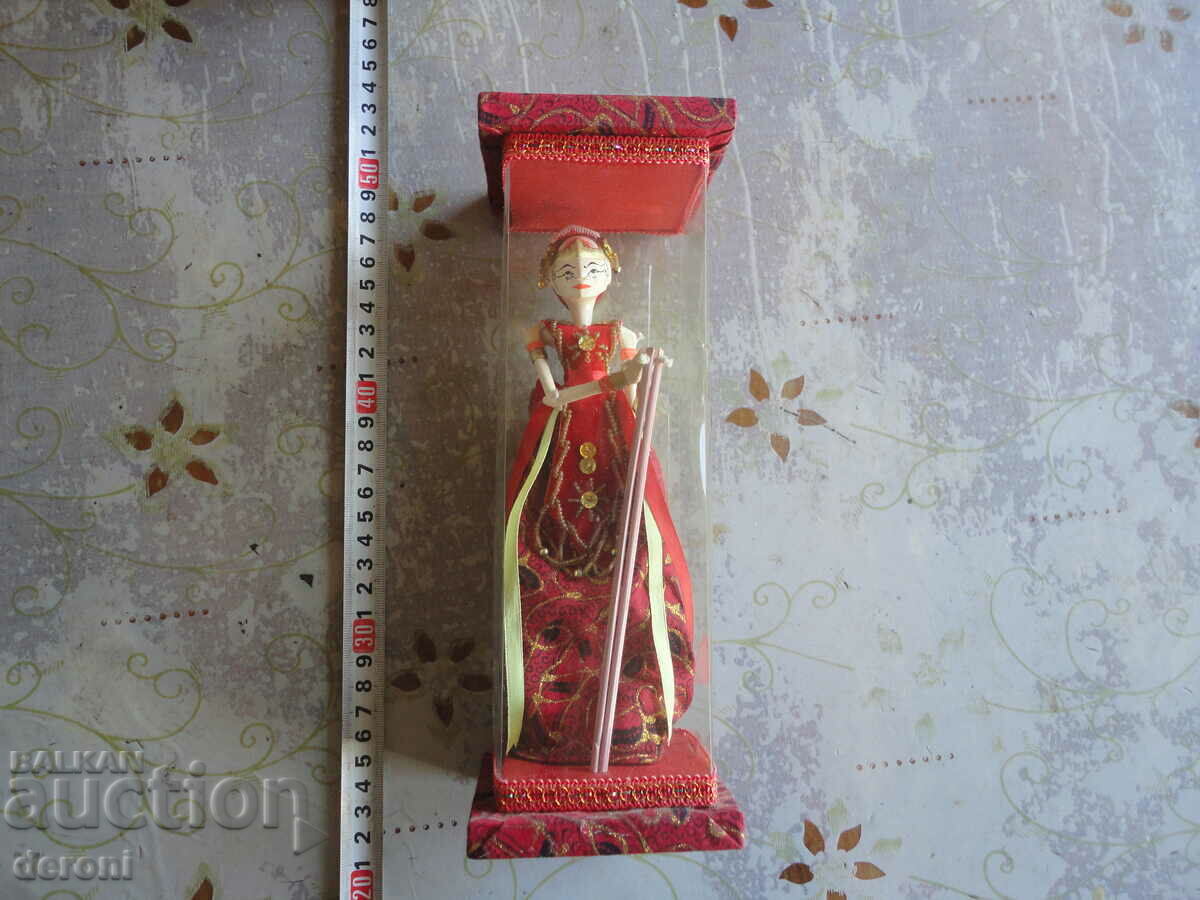 Vintage wooden doll in a box