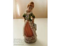 Old porcelain figure of a lady.