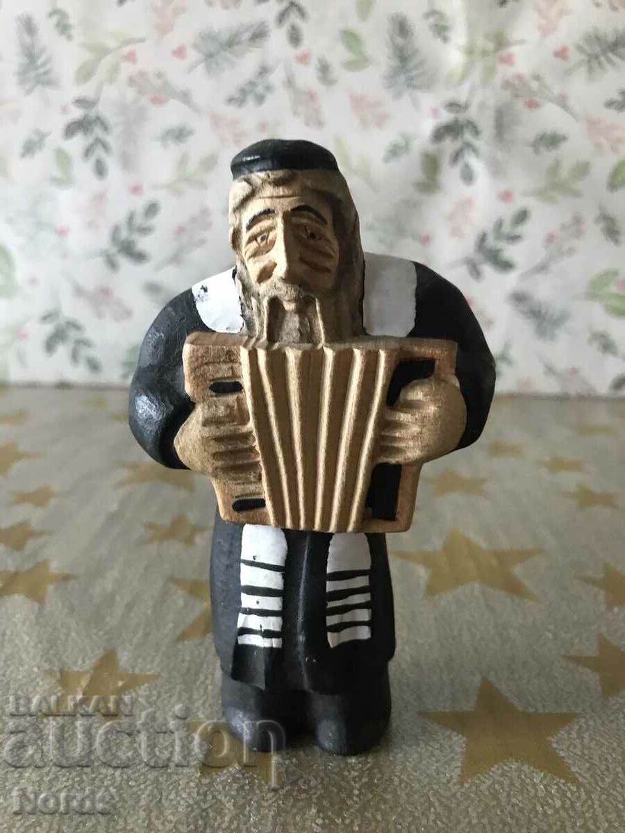 Wooden figurine of a musician