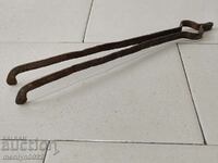 Old dilaf, tongs, wrought iron for foot