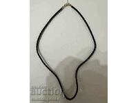 Leather necklace with gold clasp, sample 585