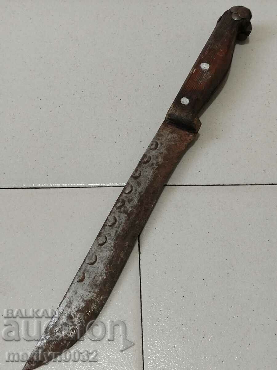 Old knife with engravings without a handle