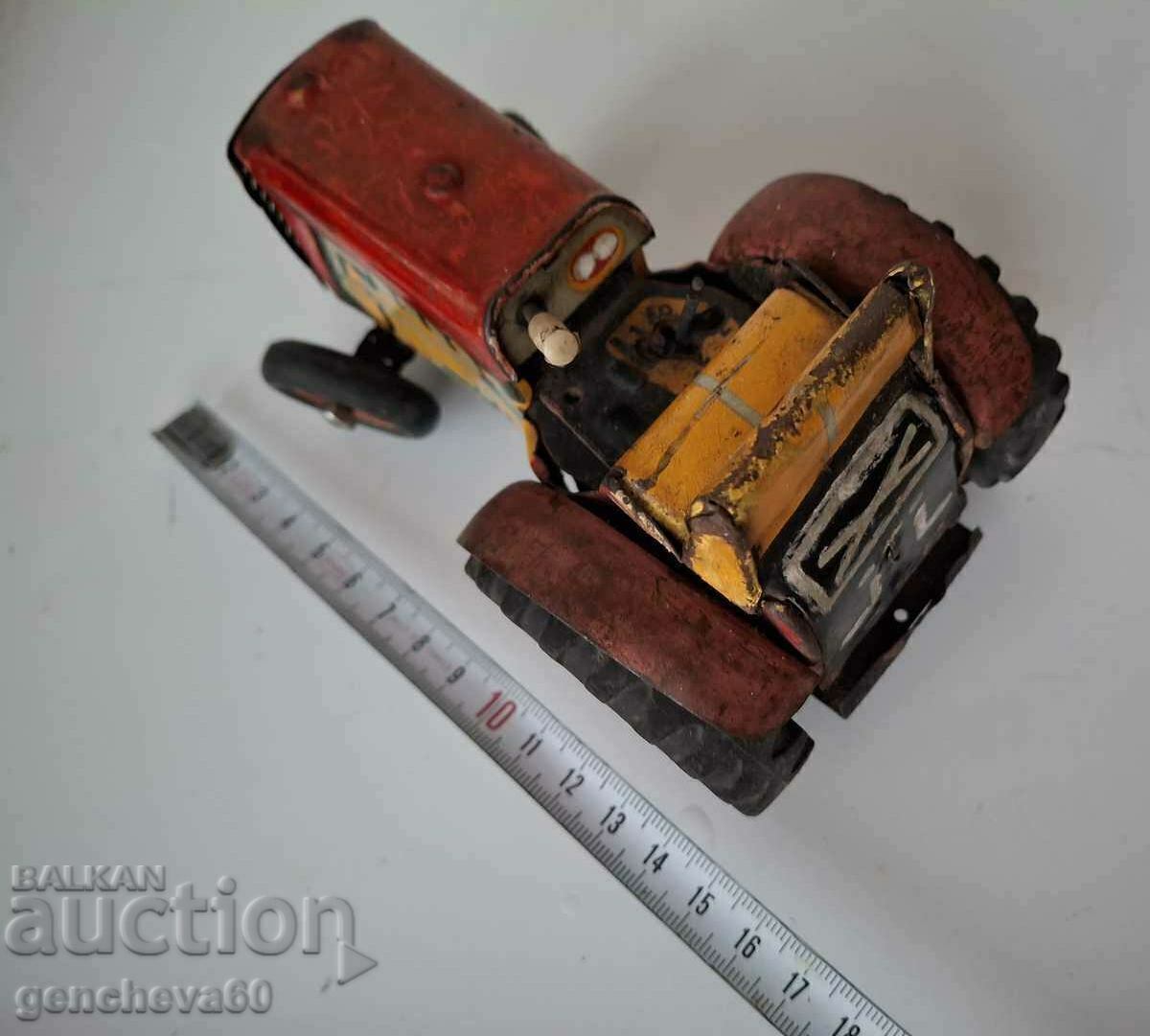 Old children's toy - tin tractor with price 21.00 BGN | € 10.74 Old children's toy - tin tractor with price 21.00 BGN | € 10.74