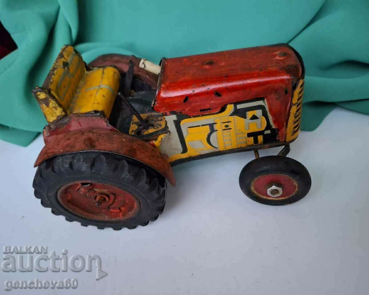 Old children's toy - tin tractor Old children's toy - tin tractor