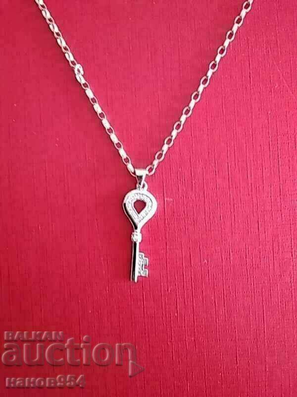 Auction Silver key chain Auction Silver key chain