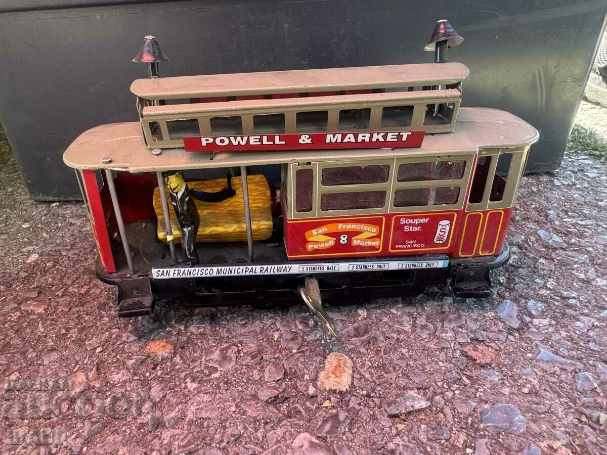 Old metal mechanical toy model tram