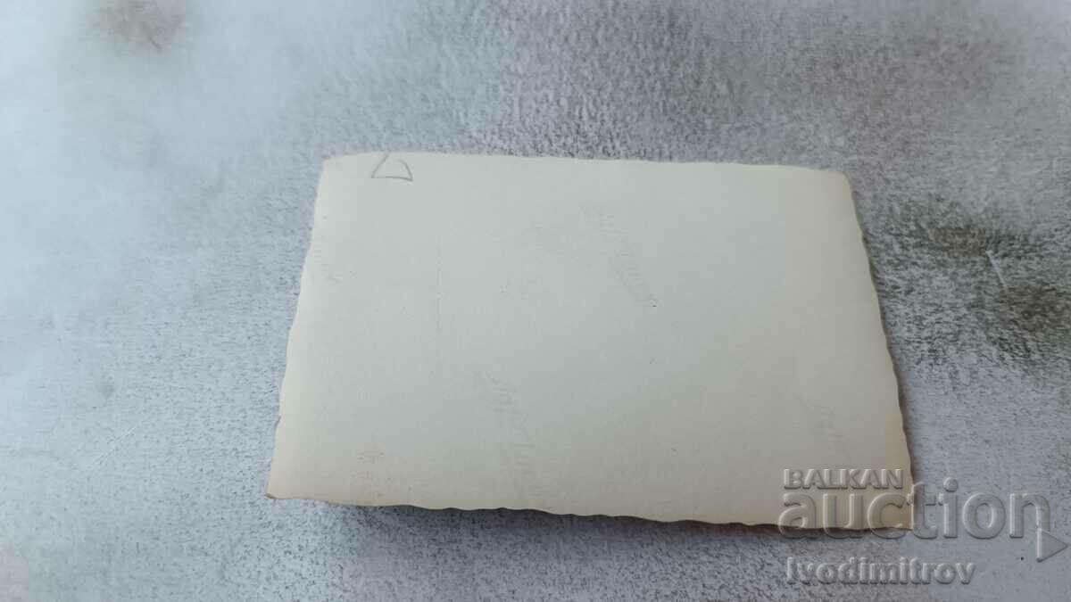 Photo A man in a swimsuit sitting on a wooden platform with price 2.45 BGN | € 1.25 Photo A man in a swimsuit sitting on a wooden platform with price 2.45 BGN | € 1.25