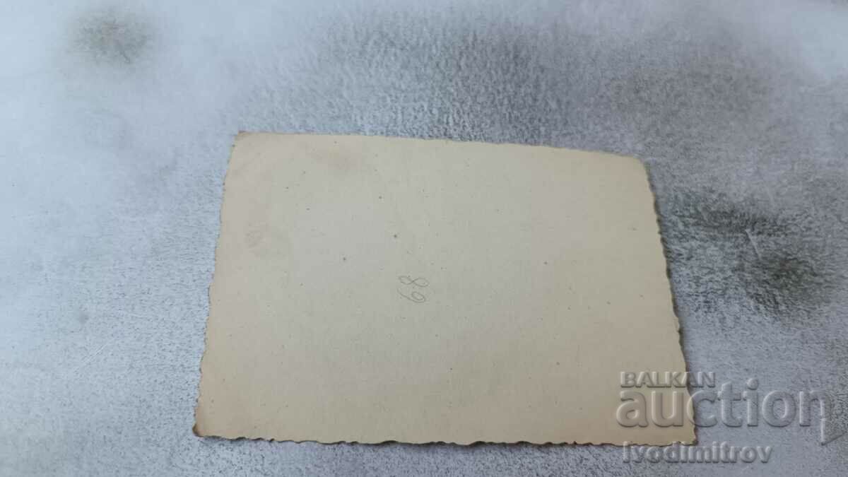 Photo Men and women lying on their stomachs on the beach with price 2.35 BGN | € 1.20 Photo Men and women lying on their stomachs on the beach with price 2.35 BGN | € 1.20