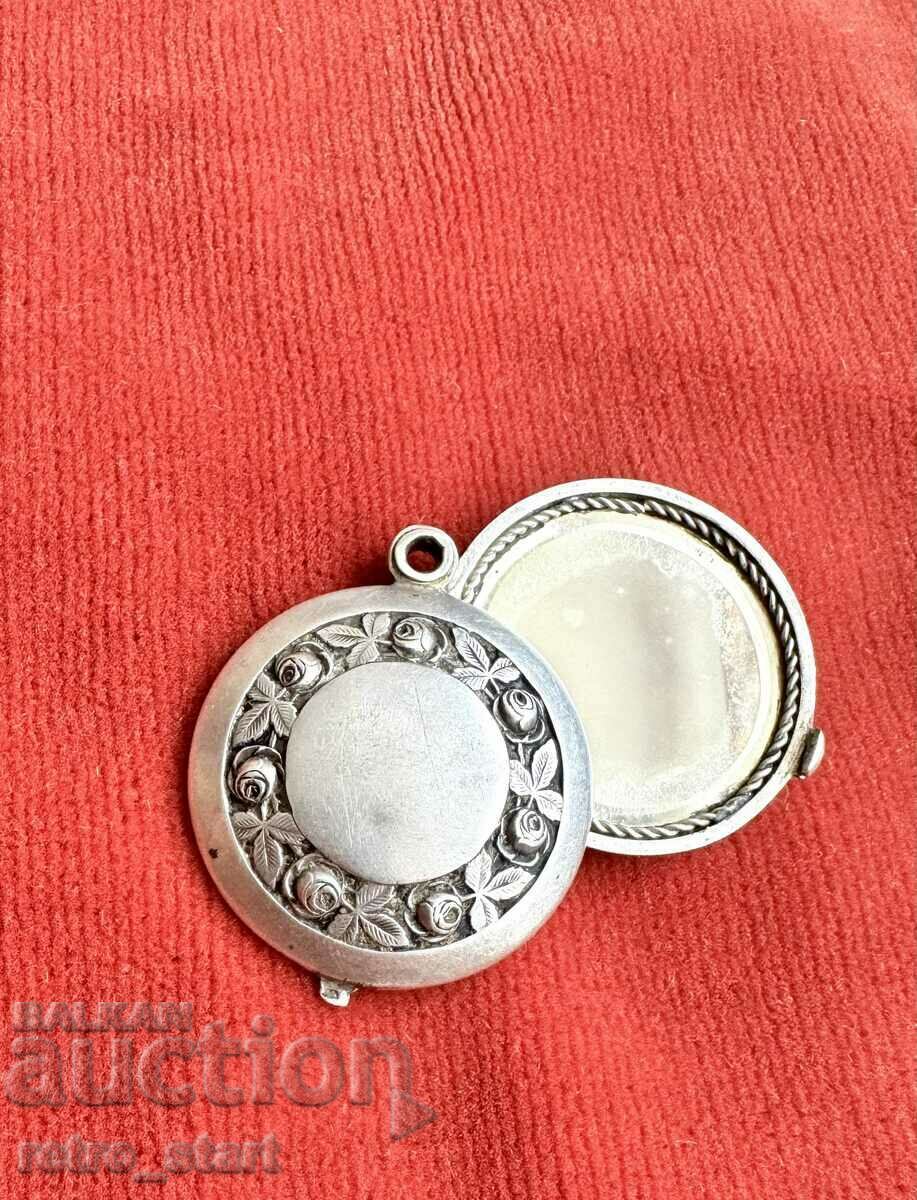 Antique silver opening locket with mirrors