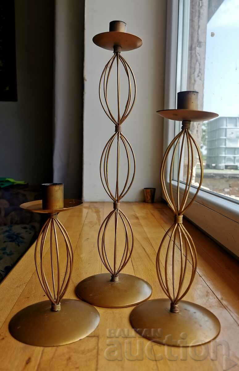 Set of three metal candlesticks