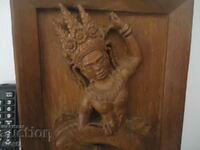 Old wood carving panel figure Indian god