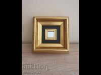 A beautiful wooden frame with a small mirror!