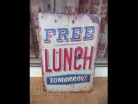 Metal sign inscription Free lunch tomorrow restaurant breakfast