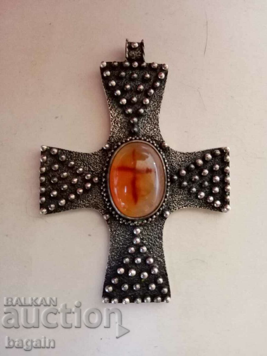 A unique silver cross.