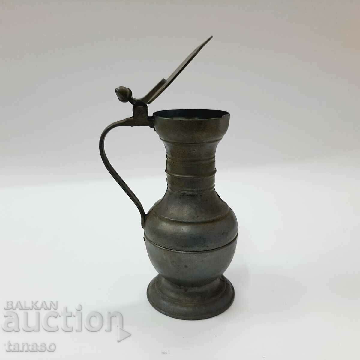 Auction  Old Moroccan pewter jug with lid(11.3)