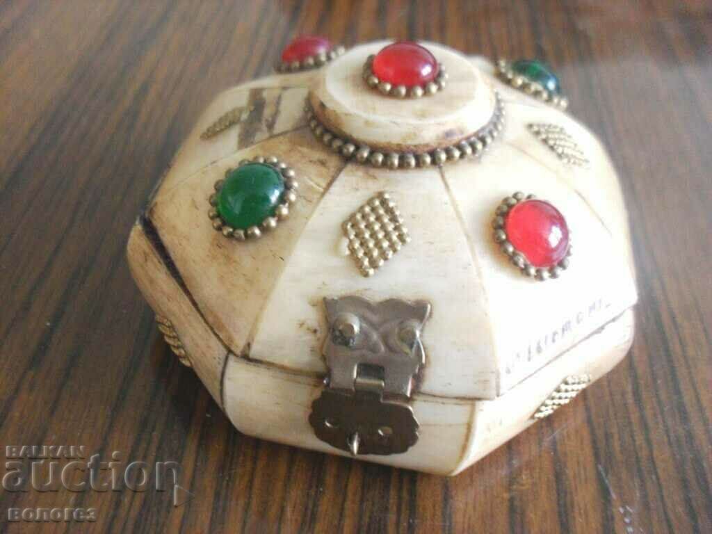 Antique camel bone box with stones