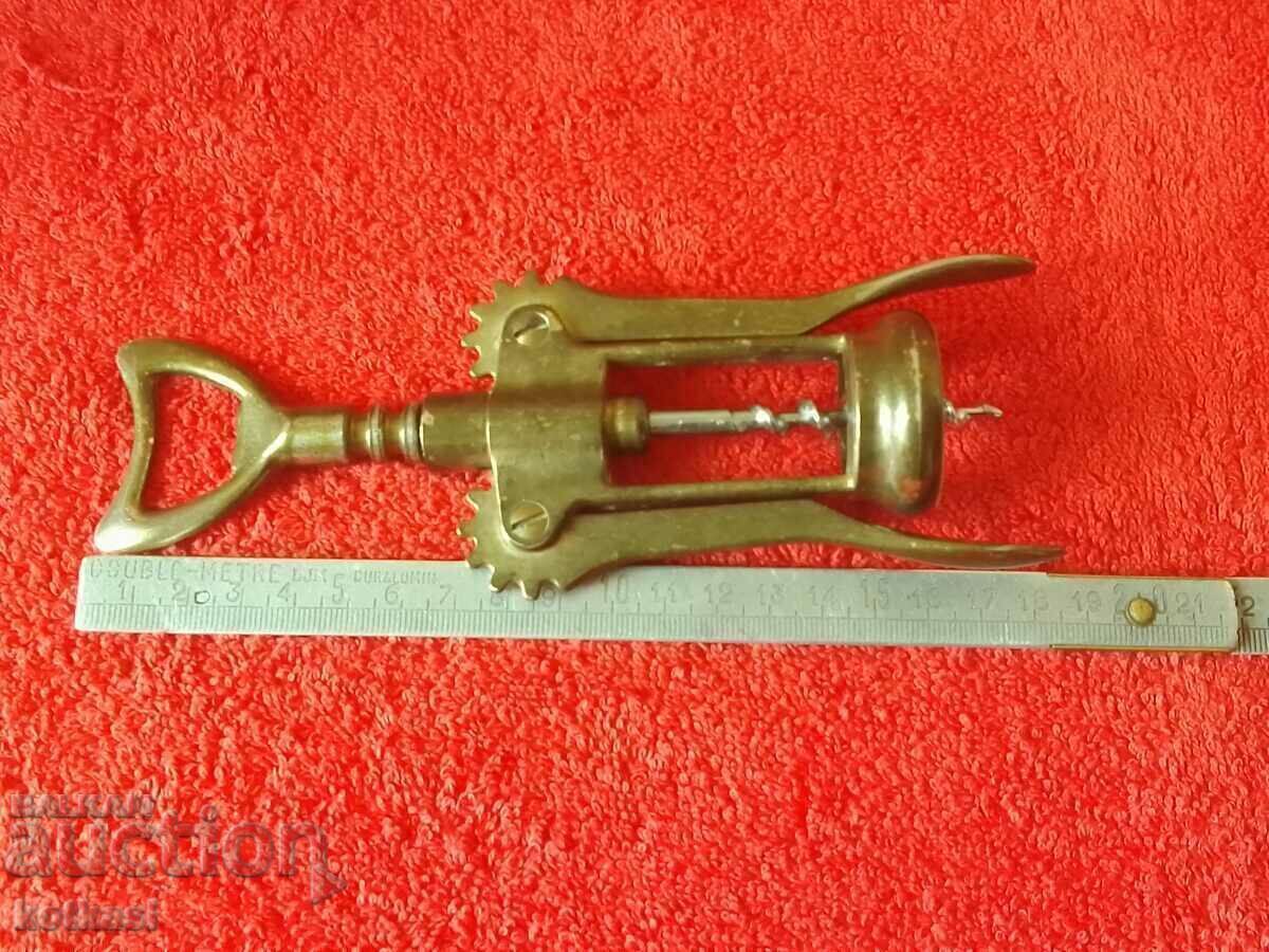 Old metal corkscrew with two arms Old metal corkscrew with two arms