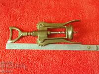 Old metal corkscrew with two arms
