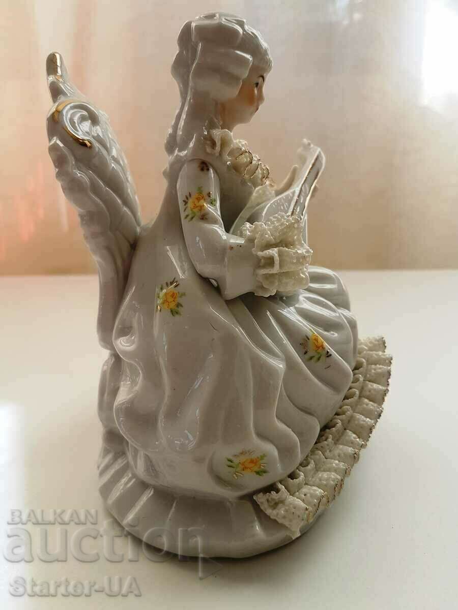 A beautiful porcelain figure of a lady with a musical instrument. with price 15.00 BGN | € 7.67 A beautiful porcelain figure of a lady with a musical instrument. with price 15.00 BGN | € 7.67
