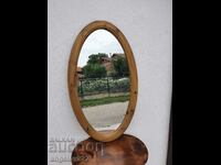 A large mirror in a massive wooden frame!!!