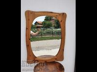 A large mirror in a massive wooden frame!!!