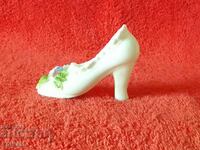 Old porcelain figure of a lady's shoe with flowers