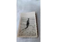 Φωτογραφία Νεαρό κορίτσι με μαγιό στην παραλία